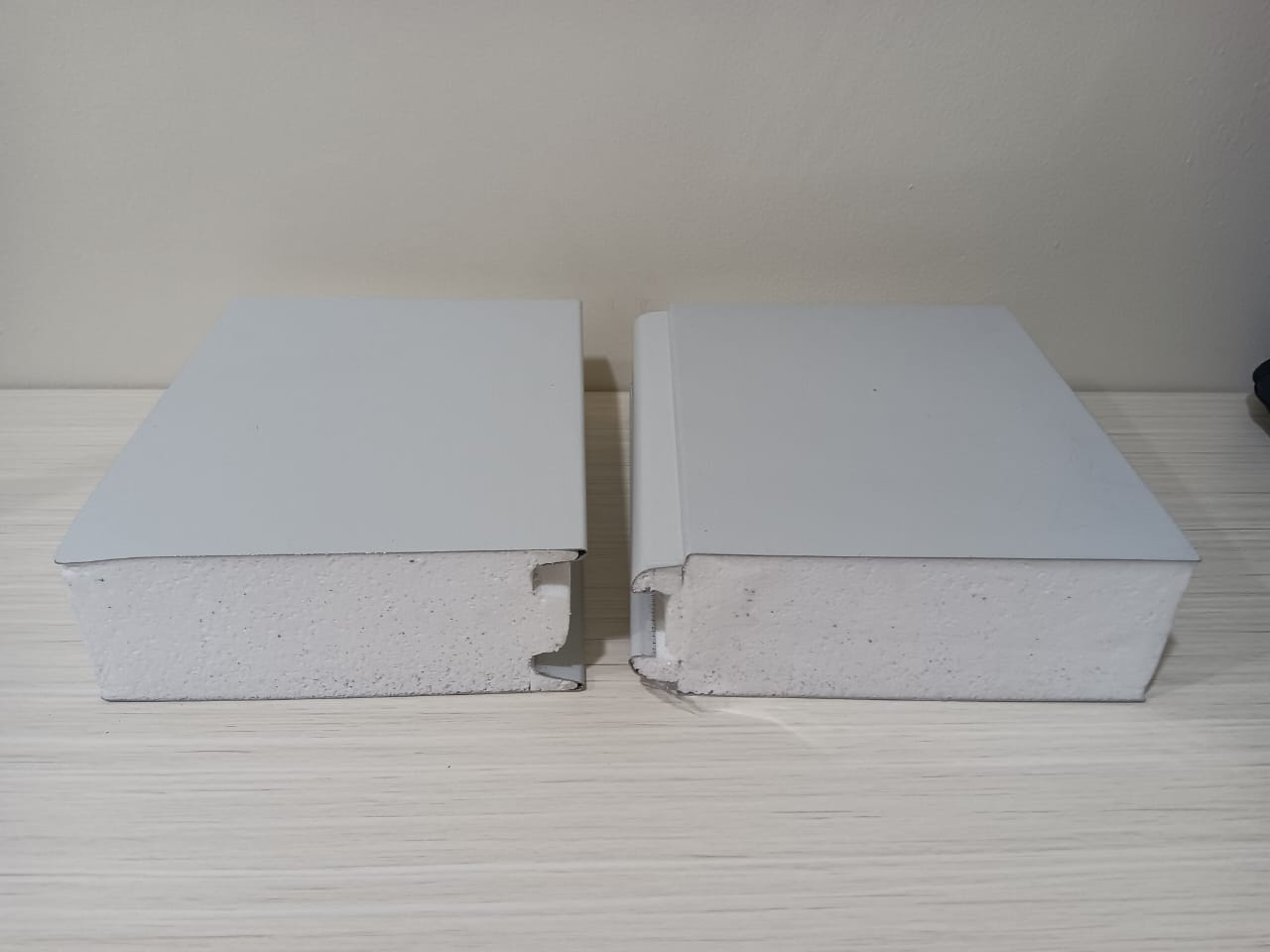 EPS core sandwich panel samples showing the tongue-and-groove interlocking joint profile