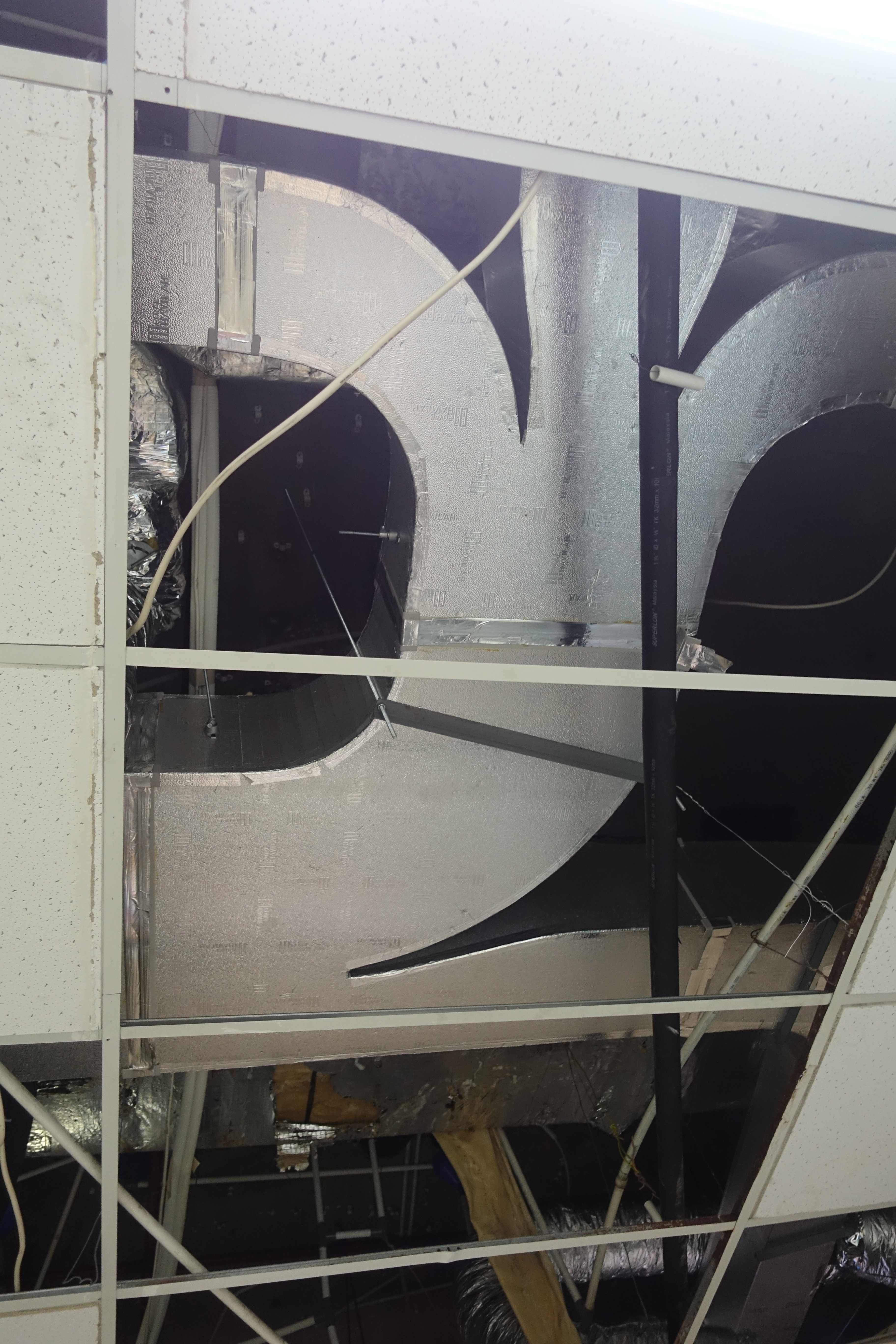Royal Duct board HVAC ducting installed across a ceiling void with foil-faced insulation