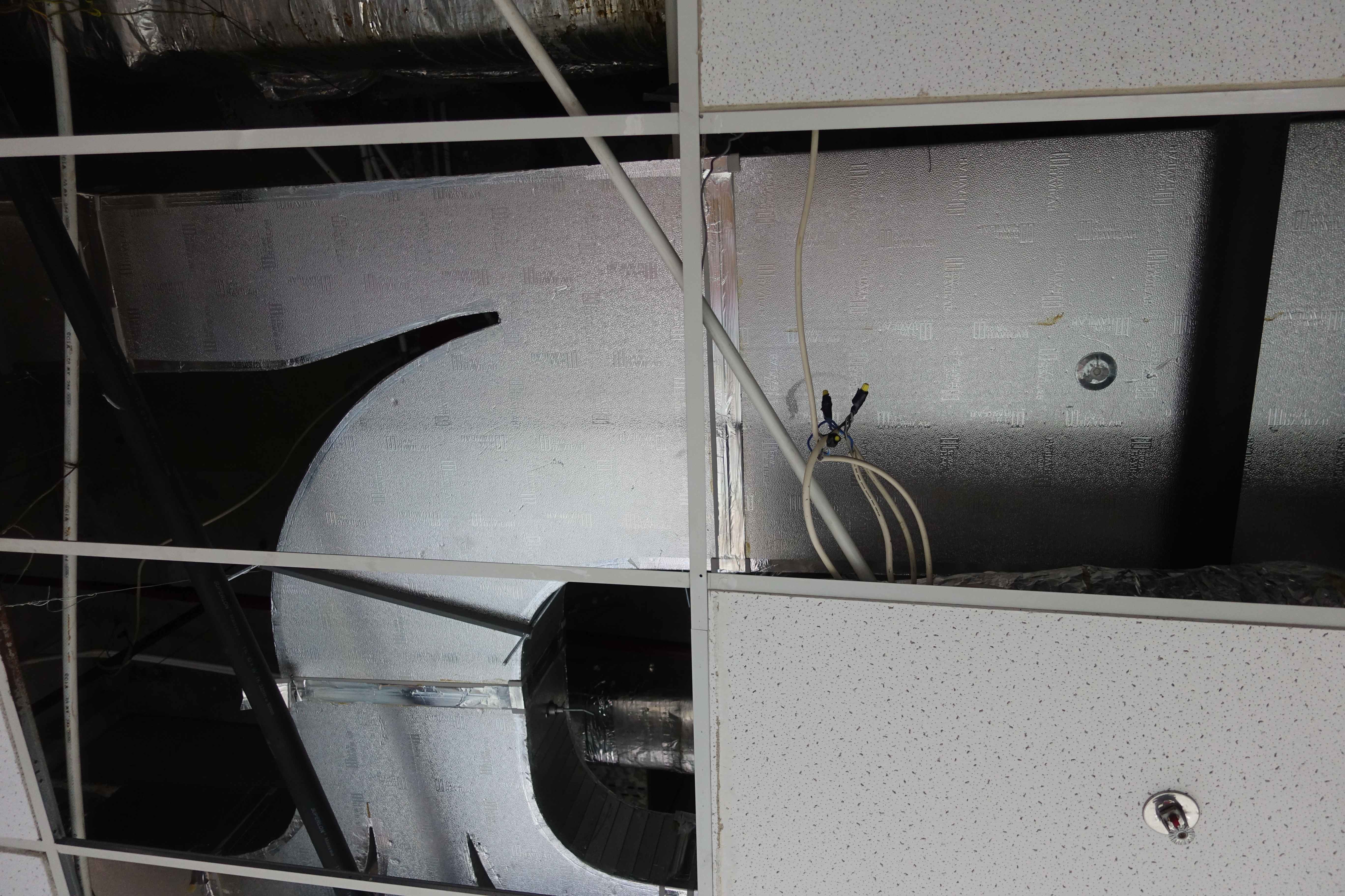 Insulated rectangular HVAC ducting fabricated from Royal Duct board in a ceiling void