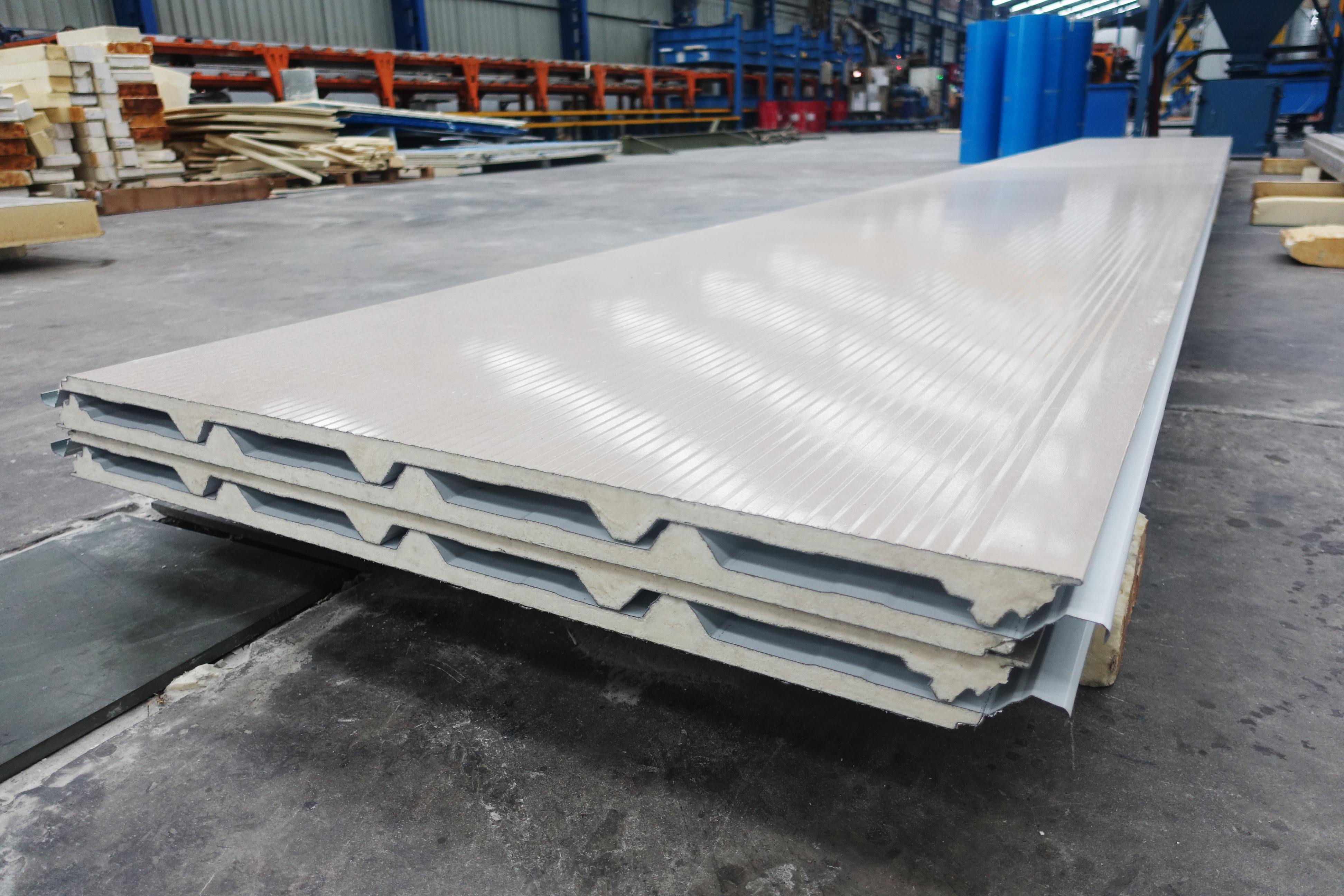 Stacked PIR insulated roof sandwich panels with trapezoidal profile in the factory
